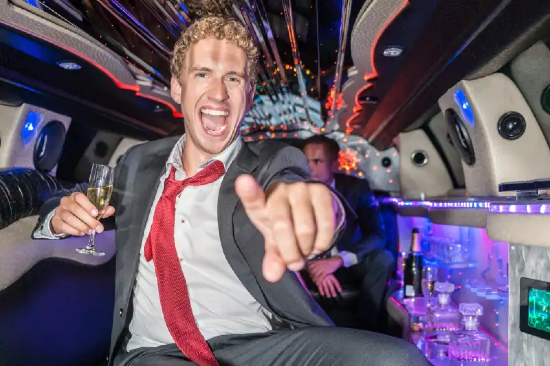man partying in a limousine